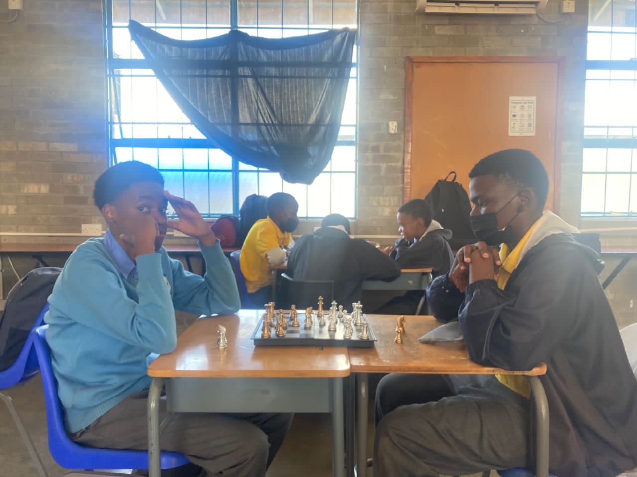 Students playing chess in the Chess Club